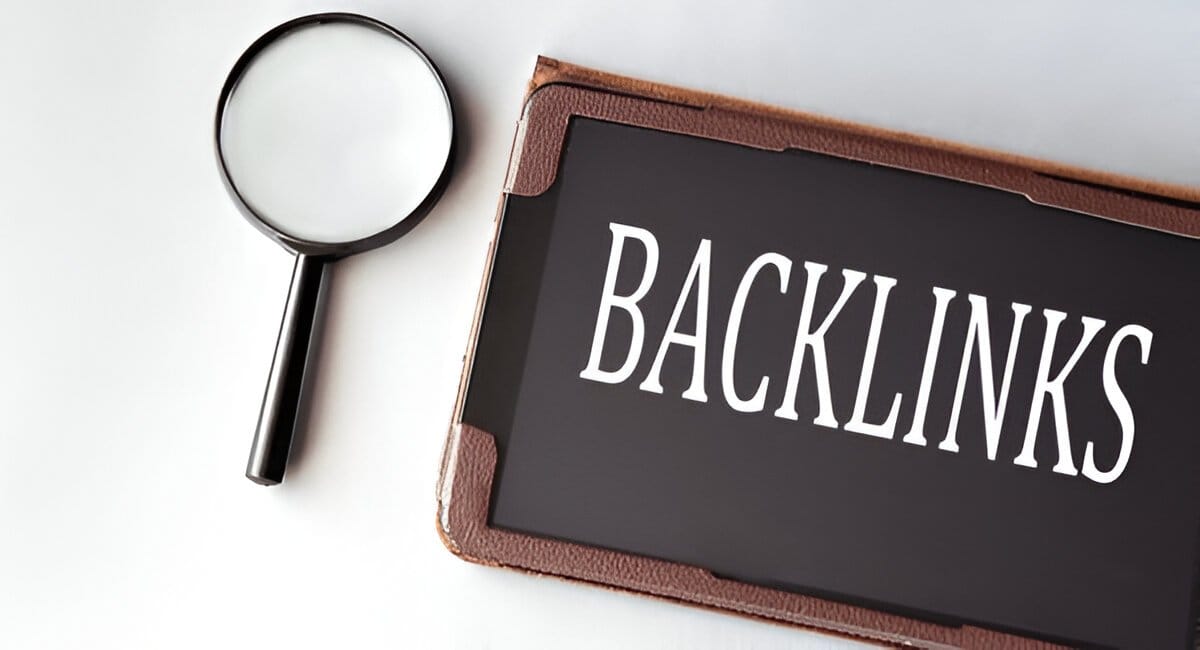 Magnifying glass next to a sign reading "Backlinks," emphasizing the need to scrutinize link quality.